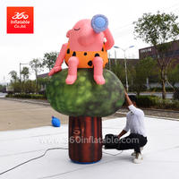 Custom high advertising inflatable cartoon movie character Primitive human sitting on the tree exhibition show decoration